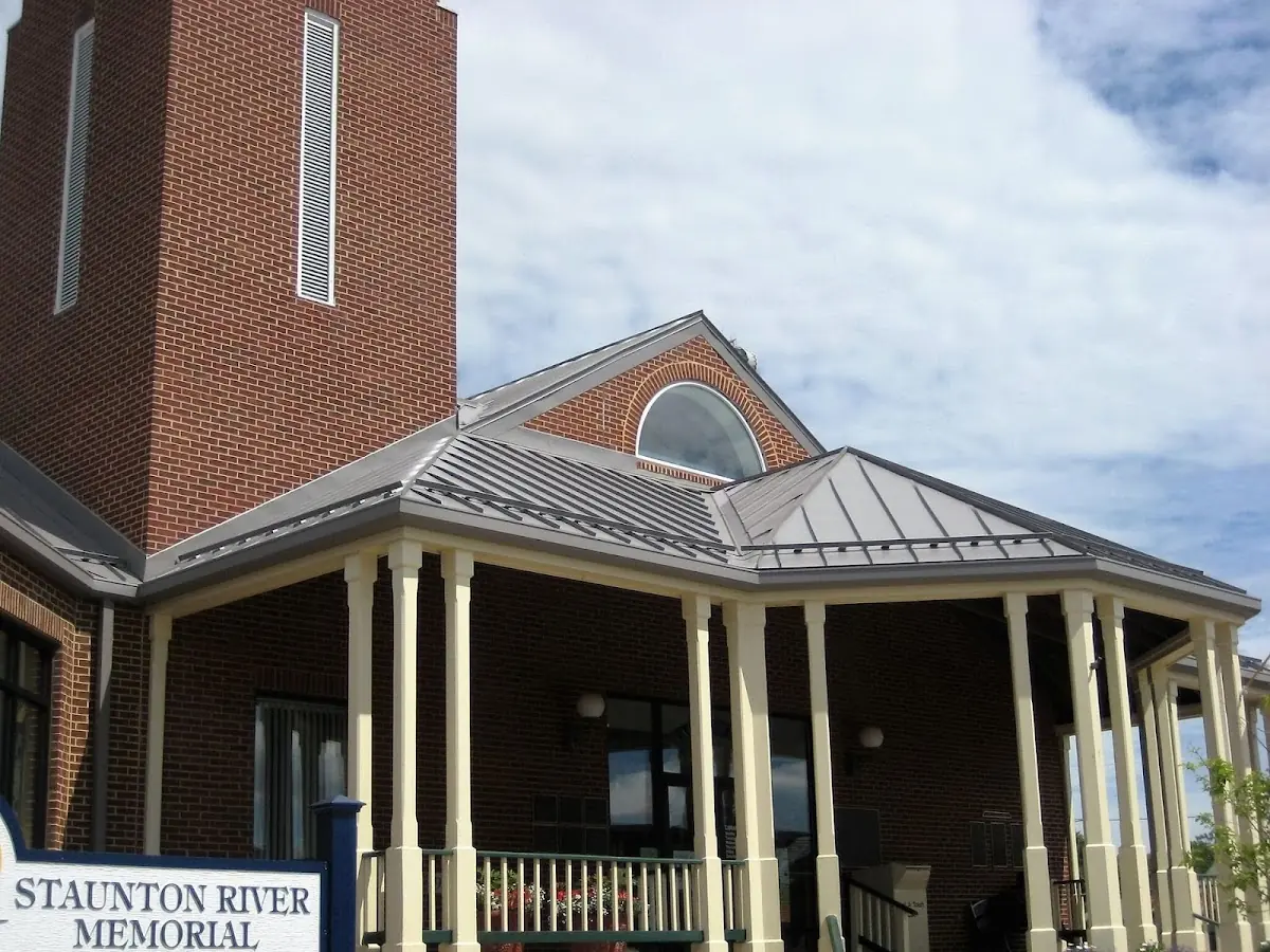 Skilled roofing craftsmen working on a residential roof in Albertville